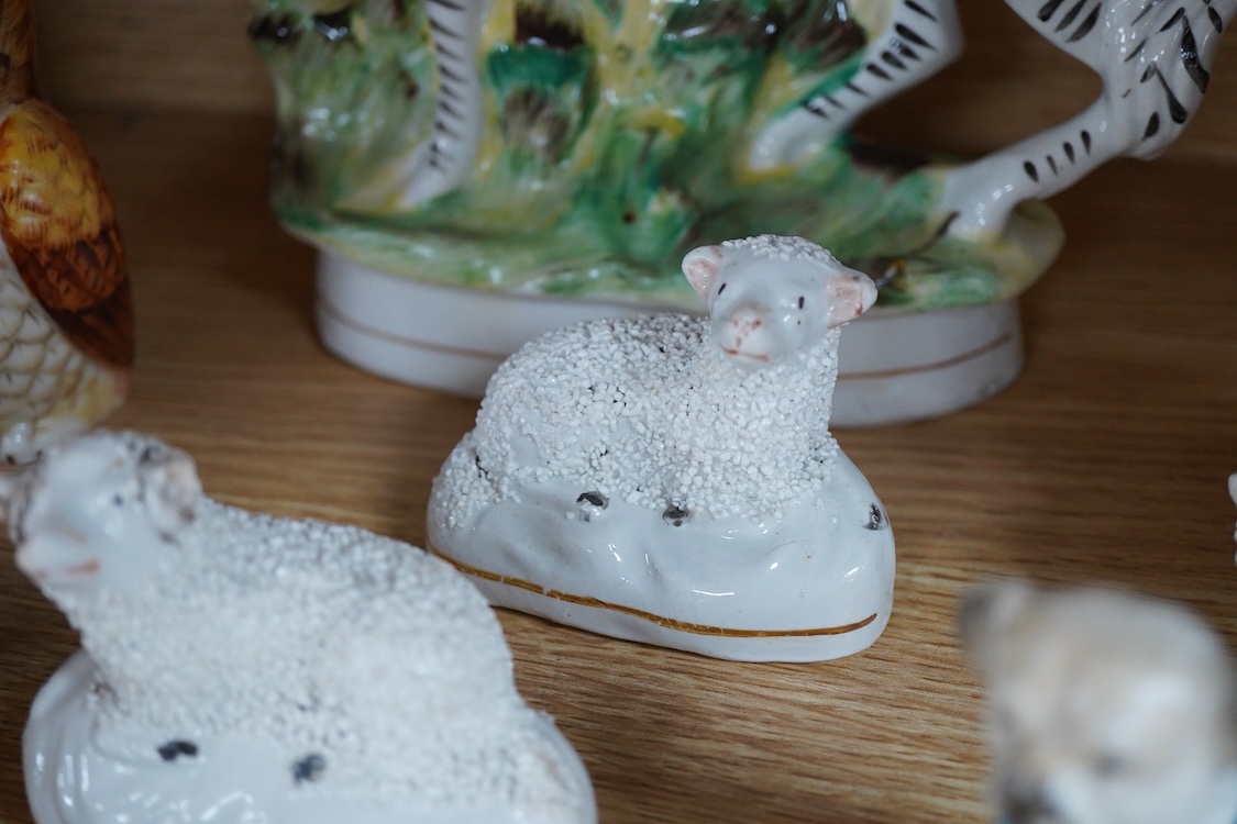 A pair of Worcester 'owl' candle snuffers, Staffordshire Zebra and two sheep, Belleek etc zebra 19cm wide.